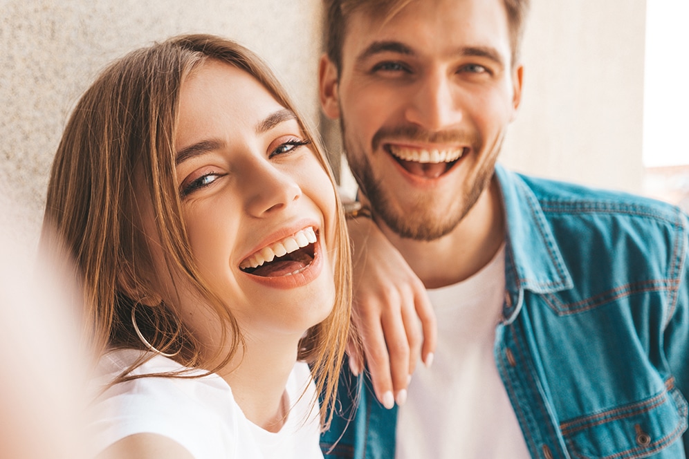 Smiling beautiful girl and her handsome boyfriend