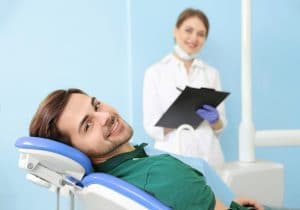 man comfortable at dentist's office